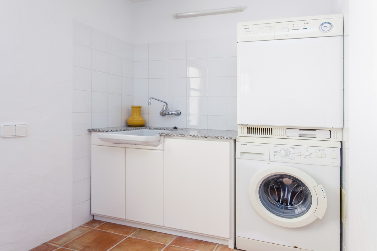 Laundry area equipped with washer and dryer